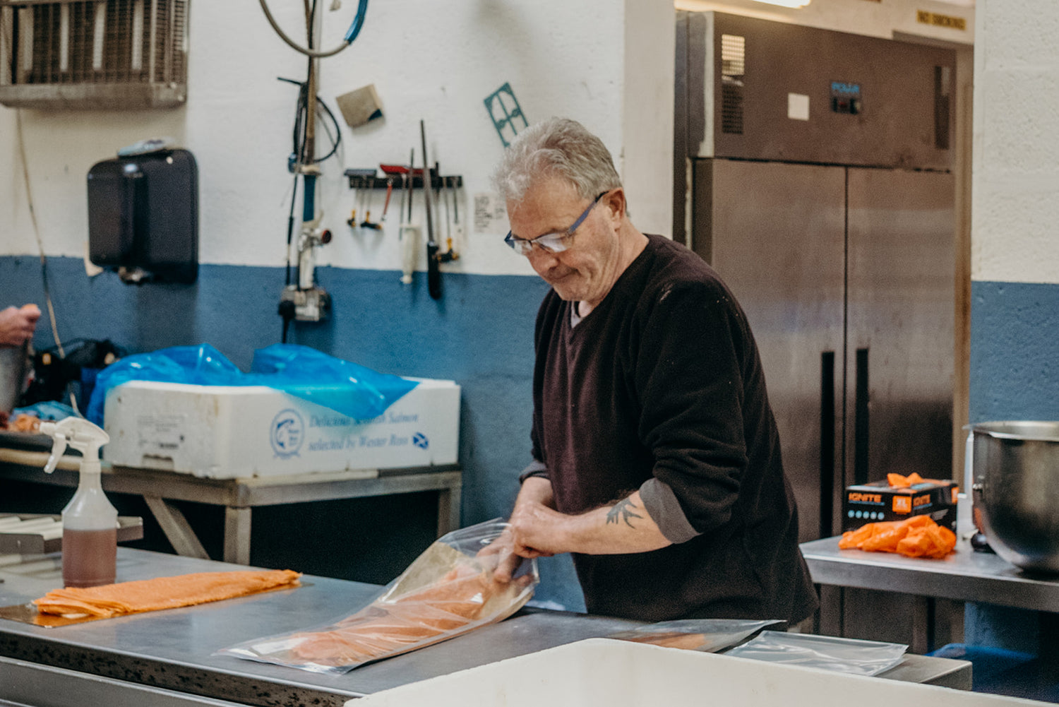 Production team packing salmon at Ullapool Smokehouse - Pesky