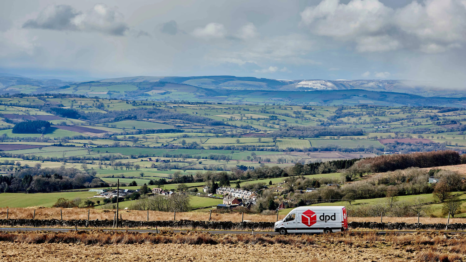 DPD Courier van travelling across countryside - Pesky